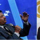 Neil deGrasse Tyson in 2015 in New York City; rapper B.o.B in 2011 in Los Angeles
JP Yim/Getty Images; ROBYN BECK/AFP/Getty Images